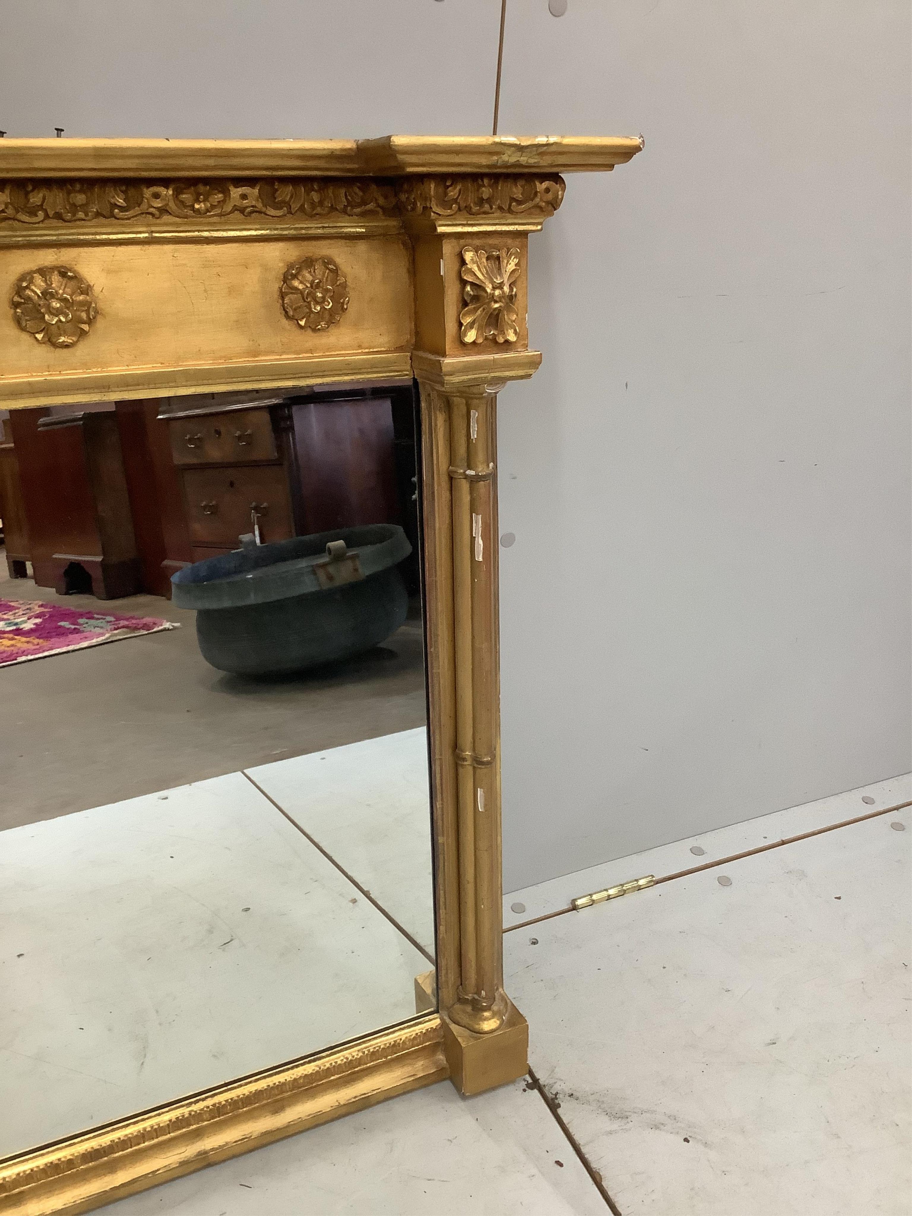 A Regency giltwood and composition overmantel mirror, width 193cm, height 81cm. Condition - fair